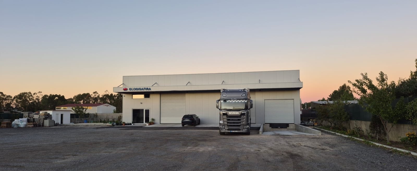 Globisafira head office and warehouse in Palmela, with a truck parked in front at dusk